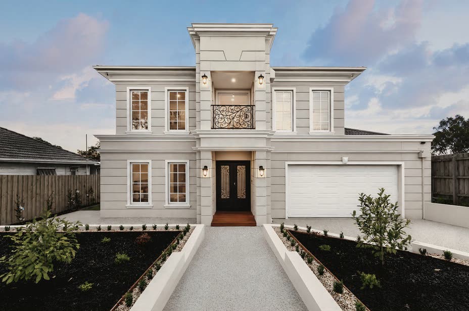 Talbot Road, Mount Waverley. A rendered two storey home in Mount Waverley, seen from the street at dusk.
